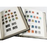 A collection of British stamps in two Stanley Gibbons Windsor albums, spacely populated, together