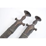 Two 19th Century Indian Talwar swords, both having same handle and curved blade, one blade