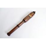 A William IV wooden truncheon, having decorative hand painted design of crown and royal cipher to
