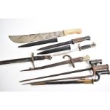 An assortment of various blades and bayonets, to include three sockets, a green blade machete, a