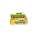 A Dinky Toys 154 Hillman Minx, two-tone issue, green lower body, cream upper body and hubs, in