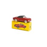 A French Dinky Toys 24m Volkswagen Karmann Ghia, red body, black roof, plated convex hubs, in