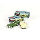 Corgi Toys 301 Triumph TR2 Sports Car, two examples, first dark green body, second cream body,