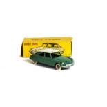 A French Dinky Toys 24c Citroen DS19, green body, white roof, convex hubs, in original box, E, minor