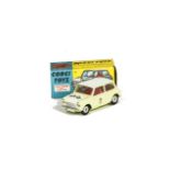 A Corgi Toys 227 Morris Mini-Cooper Competition Model, primrose yellow body, red interior, white