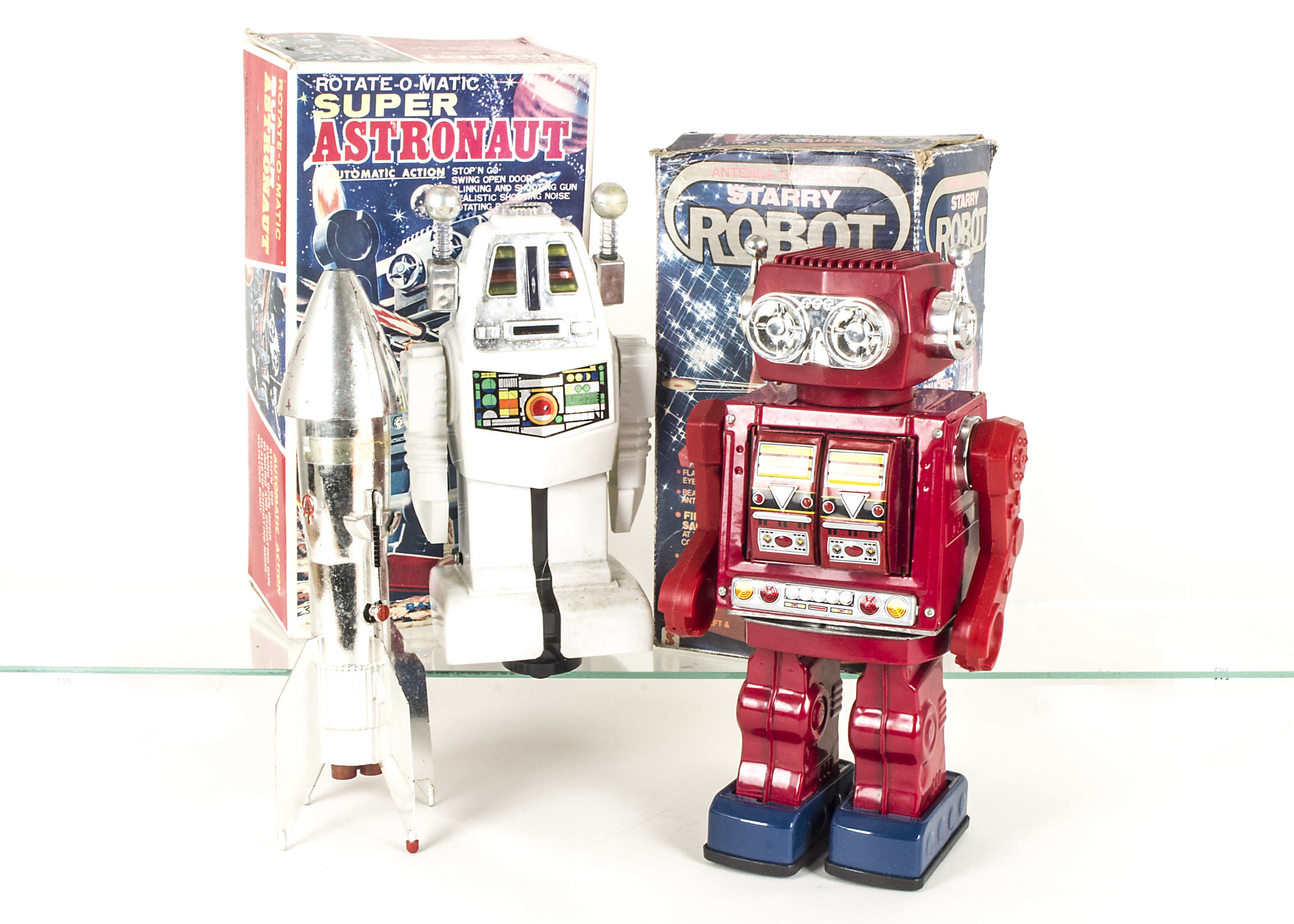 S.J.M (Taiwan) Battery Operated Rotate-O-Matic Super Astronaut Robot, red tinplate body, plastic