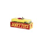 A Dinky Toys 131 Cadillac Eldorado Tourer, yellow body, cerise interior, grey driver, spun hubs,