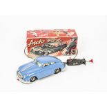 A Gescha Nr.559 Tinplate Auto Fox Porsche, mid blue body, plated trim, dog in window, control