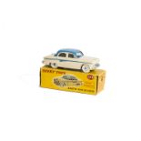 A Dinky Toys 176 Austin A105 Saloon, cream body, mid-blue roof and panel line, spun hubs, in