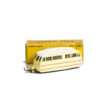 A French Dinky Toys 811 Caravan, cream body with red stripes, white roof, convex hubs, in original