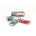 Corgi Toys 302 M.G.A Sports Car, two examples, first light metallic green body, second red body,