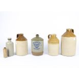 Five stoneware bottles, for 'H. W. Pocock, Marlborough' (2), 'Dowling & Sherwood, Andover' and '