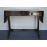 A Regency style 19th Century mahogany sofa table, the two short drawers to one side, with swept