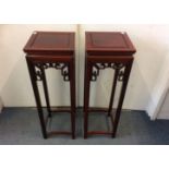 A pair of contemporary Chinese hardwood plant stands, square mount, 30.5cm square x 92cm height (2)