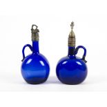 A pair of antique hand-blown Bristol blue claret jugs, each of squat globular form, pontil marks