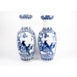 A large pair of 20th Century Chinese porcelain vases, in blue and white glaze, each decorated with a