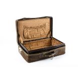 A 20th Century travelling case in faux crocodile skin, with brass fixtures and brown lined interior,