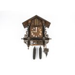 19th Century Black Forest carved Trumpeter wall clock, chalet case with scroll and leaf