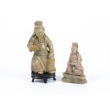 A Chinese soapstone figure of Guanyin on a lotus base, height 13cm, together with a seated Chinese
