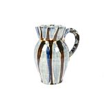 David Garland (b1941-) pottery jug, earthenware with cream slip, blue and brown brushwork, height
