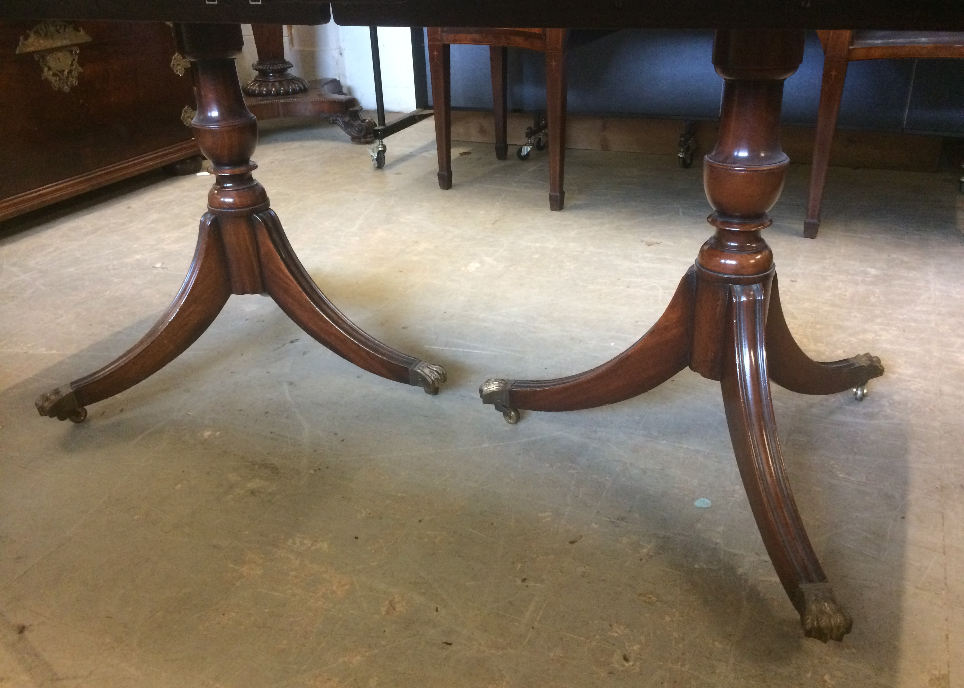 A Regency style mahogany twin pedestal dining table, with extra leaf, impressed 2761 to underside, - Image 3 of 3