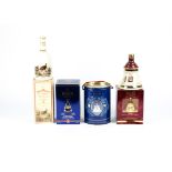 Six Bells Whisky decanters together with a bottle of Famous Grouse, including examples for The Queen