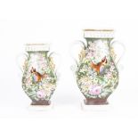 A pair of Continental Victorian vases, both with the same elaborate scrolling twin handled form,