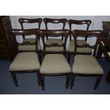 A set of six Victorian mahogany Dining chairs, raised on tapering turned supports, upholstered in
