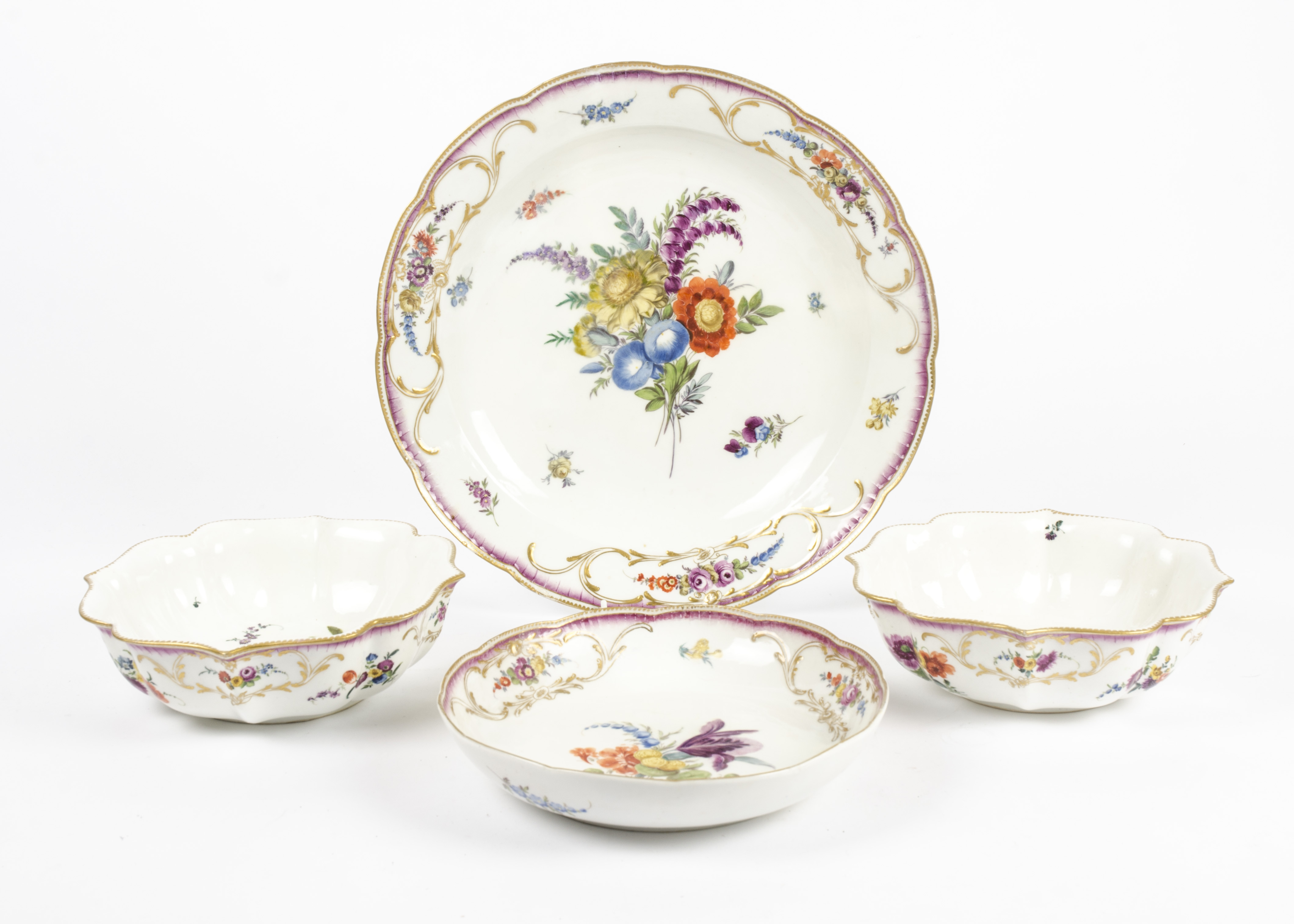 A large 19th Century Meissen dish, together with two bowls and a further dish, all from the same