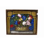 A 19th Century panel of stained and painted glass, each leaded segment designed as a basket or