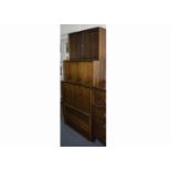 A 1960's Danish six bay wall unit, comprising of five shelves and a cupboard by Poul Cadovius made