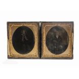 Two Victorian ambrotypes, the first of a gentleman with top hat and walking stick, the second of a