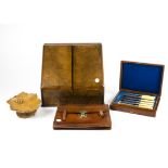 A large oak stationery box opening to reveal multiple compartments, 39cm x 34cm, together with a