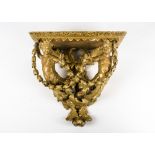 A gilt gesso carved wooden wall bracket, taking the form of two outstretched putti holding