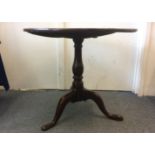 An antique oak circular tripod table, 75cm diameter x 69cm high