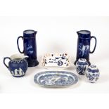 A pair of Ridgway blue and white transfer printed jugs one with a bulldog the other a cat,