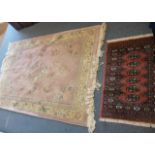 A 20th Century pink ground woollen rug, having multi border with floral decoration, together with