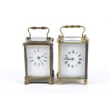 Two 20th Century carriage clocks, both with white dials and Roman numerals, brass framed five