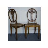 A pair of Edwardian satinwood Sheritan style side chairs, with swag back splats, cane seats and