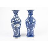 A pair of Chinese blue and white export vases, with everted rims, and prunus blossom decoration in