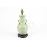 A Chinese pottery lamp base of archaistic style, in the manner of metalwork forms excavated from