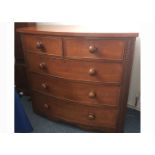 A Victorian mahogany veneered bow front chest of drawers, two short above three long graduated