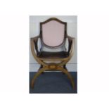 An Edwardian mahogany inlaid X-Frame armchair, with panelled seat and striped upholstered padded