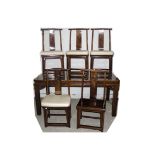 An assembled Chinese hardwood dining room set comprising a dining table, the oblong top with