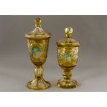 A pair of late 19th Century or early 20th Century Bohemian citrine lidded glass vases and covers,