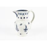 An 18th Century Caughley or Worcester cabbage leaf jug, with a moulded mask spout, painted in