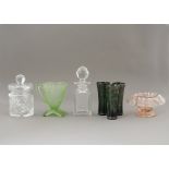 A collection of moulded glassware, consisting of a decanter, two jars, a pink bowl, green jug and