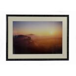 An original photographic print 'celestial skies', showing Corfe Castle in Dorset at dusk or dawn,