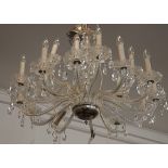 A large 20th Century eighteen branch cut glass chandelier, arranged in two tiers, each hung with cut