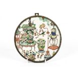 A Qing dynasty Chinese export circular porcelain panel painted in the Wucai palette, contained